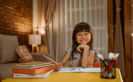 Girl studying for academic excellence, a good focus for most parents in Singapore?